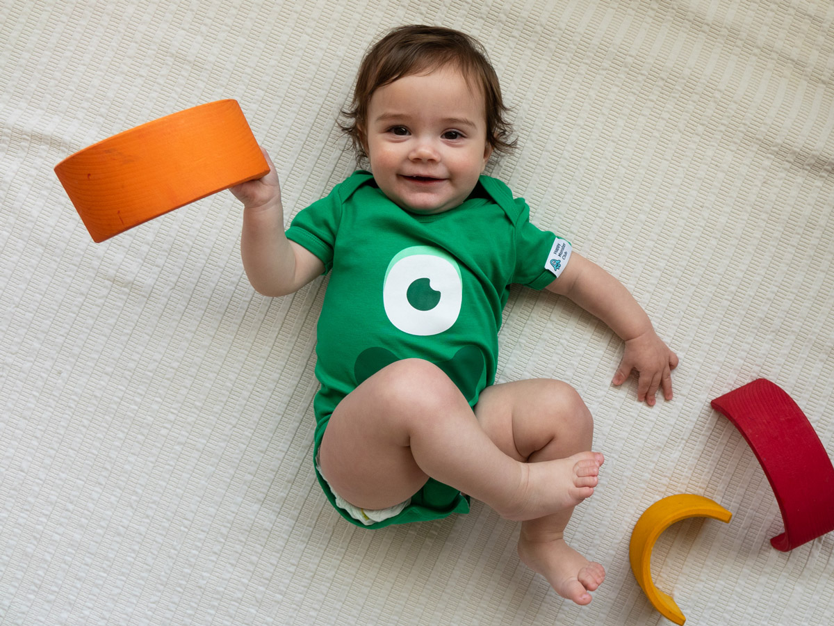 Image of a toddler wearing a Happy Monster Club body