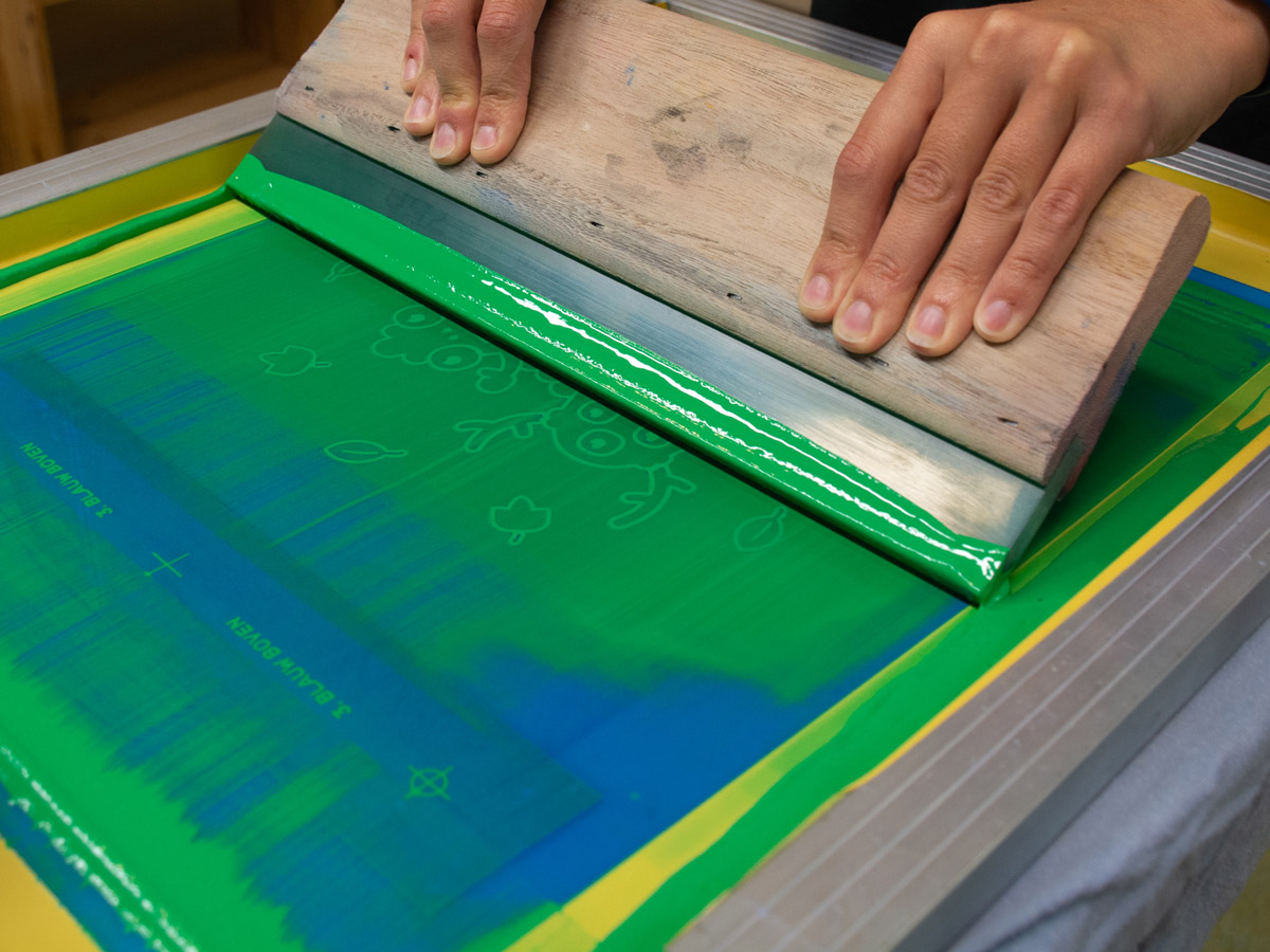 Afbeelding van het print proces bij zeefdruk